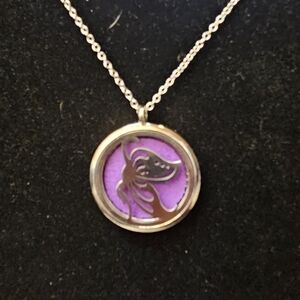 An Elegant Aromatherapy Silver and Purple Pendant Necklace.